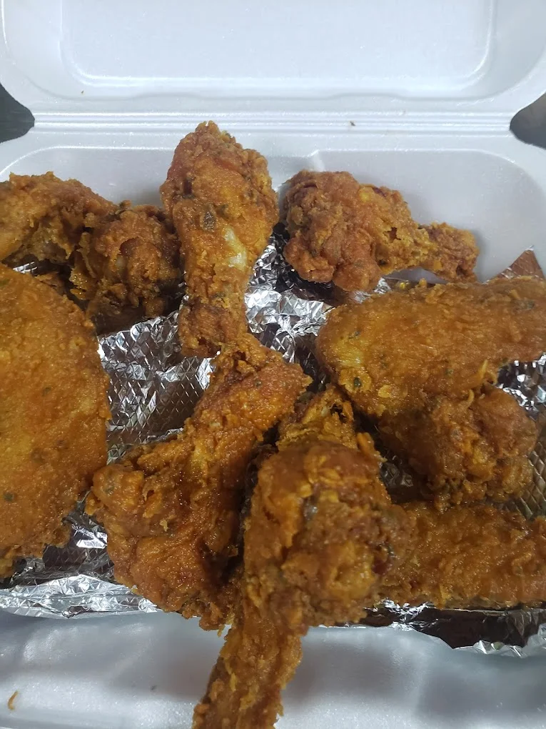Crispy Chicken Wings - Our signature wings — perfectly seasoned and fried to golden perfection. Try them garlic parm, BBQ, or your favorite sauce.